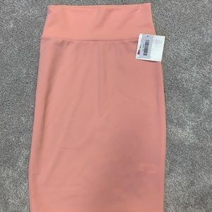6 Super soft, fitted, stretchy pencil skirts from LulaRoe. $12 a piece!